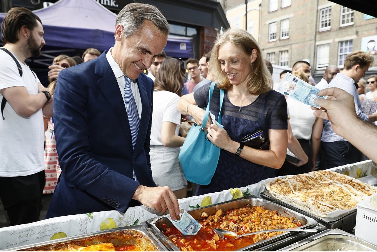 carney dipping polymer note into curry