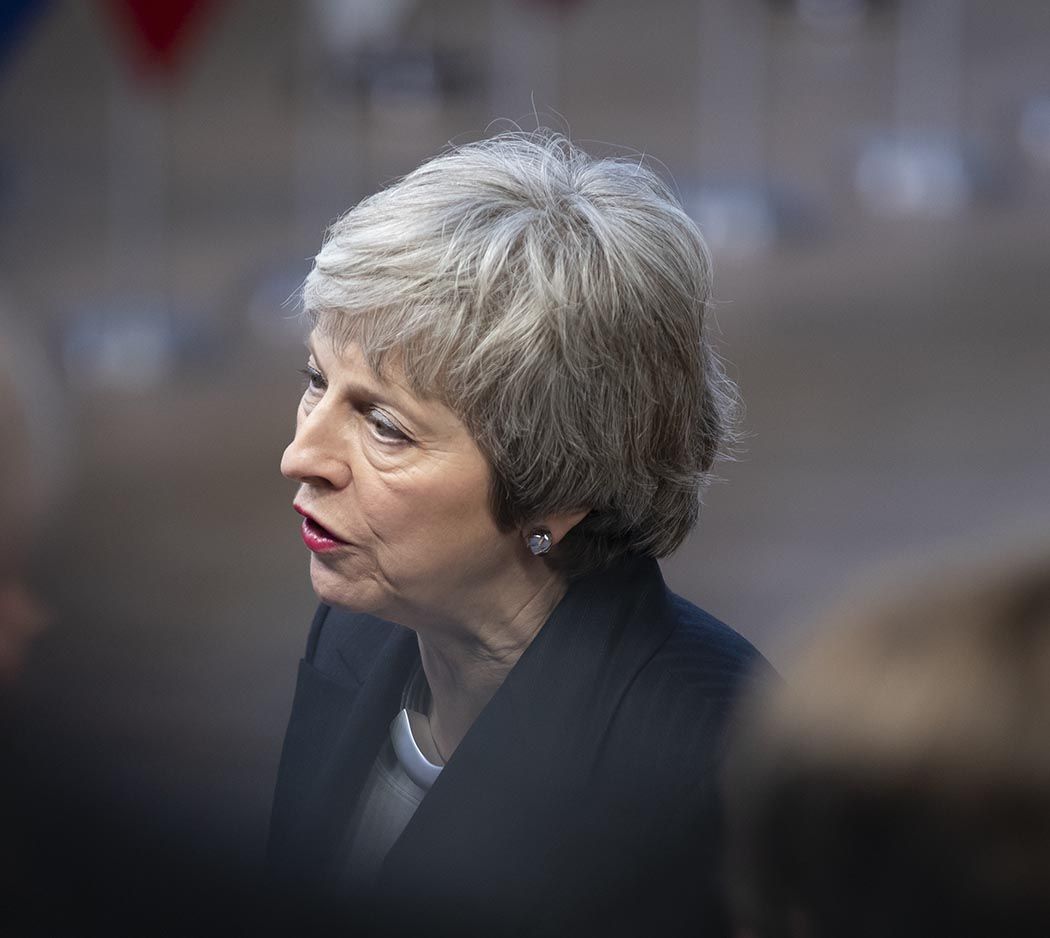 May addressing reporters