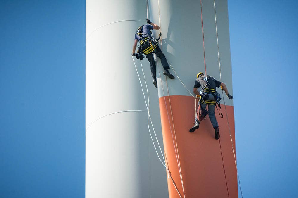 Windfarm workers inspecting