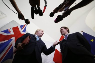 Johnson in front of the press