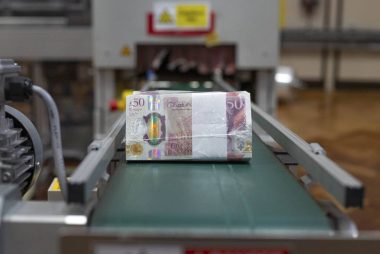 Bank of England Cuts Quantitative Easing and Raises Forecasts